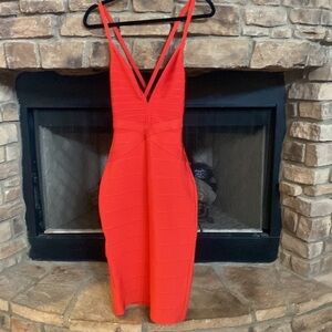 NWT vibrant red bodycon dress with cross cross strap. Size large.